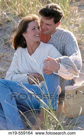 couple in beach sand dunes View Large Photo Image Picture - couple in beach sand dunes. Fotosearch