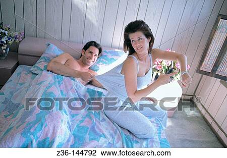 Couple in bed View Large Photo Image Stock Image - Couple in bed. Fotosearch