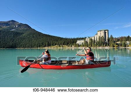 Couple in canoe in front of the hotel Castle Lake Louise, Banff National Park, Rocky Mountains, Alberta, Canada View Large Photo Image Stock Photograph - Couple in canoe in front of the hotel Castle Lake Louise, Banff National Park, Rocky Mountains, Alberta, Canada. Fotosearch