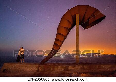Couple in Caracola, conch, by Moncho Amigo, Corua city, Galicia, Spain. View Large Photo Image Stock Photography - Couple in Caracola, conch, by Moncho Amigo, Corua city, Galicia, Spain.. Fotosearch