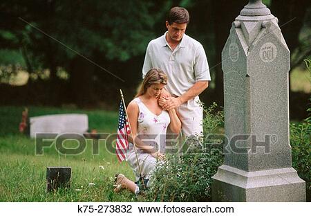 Couple in cemetery View Large Photo Image Stock Image - Couple in cemetery. Fotosearch
