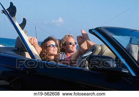 couple in convertible at the beach View Large Photo Image Stock Photo - couple in convertible at the beach. Fotosearch