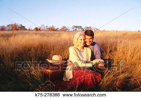 Stock Photograph - couple in fall field. Fotosearch