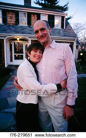 Couple in front of suburban house. Newton. Massachusetts. USA View Large Photo Image Stock Image - Couple in front of suburban house. Newton. Massachusetts. USA. Fotosearch