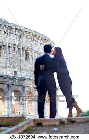 Couple in front of the Roman Colosseum Rome Italy View Large Photo Image Picture - Couple in front of the Roman Colosseum Rome Italy. Fotosearch
