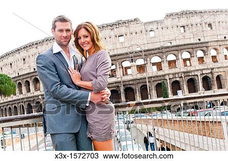 Couple in front of the Roman Colosseum View Large Photo Image Stock Image - Couple in front of the Roman Colosseum. Fotosearch