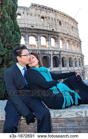 Couple in front of the Roman Colosseum Rome Italy View Large Photo Image Stock Image - Couple in front of the Roman Colosseum Rome Italy. Fotosearch