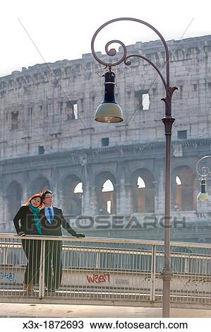 Couple in front of the Roman Colosseum Rome Italy View Large Photo Image Stock Image - Couple in front of the Roman Colosseum Rome Italy. Fotosearch