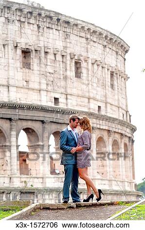 Couple in front of the Roman Colosseum View Large Photo Image Stock Photograph - Couple in front of the Roman Colosseum. Fotosearch