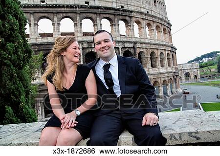 Couple in front of the Roman Colosseum Rome Italy View Large Photo Image Stock Photograph - Couple in front of the Roman Colosseum Rome Italy. Fotosearch