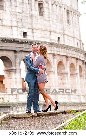 Couple in front of the Roman Colosseum View Large Photo Image Stock Photography - Couple in front of the Roman Colosseum. Fotosearch
