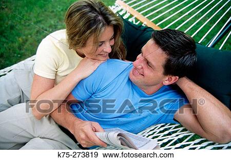 Stock Photo - Couple in hammock. Fotosearch