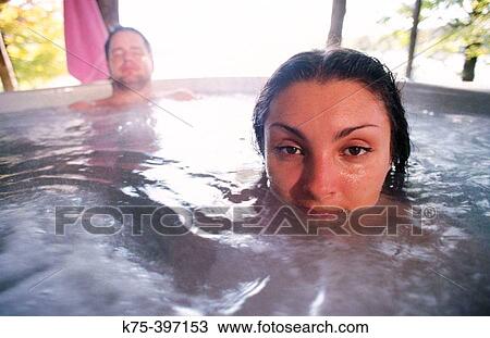 Stock Image - couple in hot tub. Fotosearch