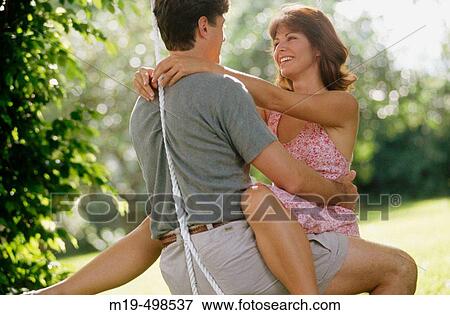 couple in love on a swing View Large Photo Image Stock Photo - couple in love on a swing. Fotosearch
