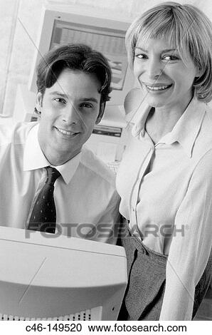 Stock Image - Couple in office. Fotosearch