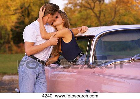 Couple in old car View Large Photo Image Stock Image - Couple in old car. Fotosearch