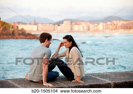 Couple in Ondarreta Wall, Donostia, San Sebastian, Gipuzkoa, Euskadi, Spain View Large Photo Image Picture - Couple in Ondarreta Wall, Donostia, San Sebastian, Gipuzkoa, Euskadi, Spain. Fotosearch