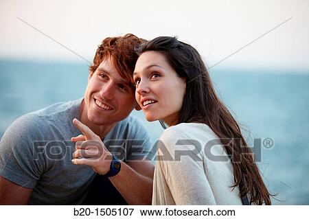 Couple in Ondarreta Wall, Donostia, San Sebastian, Gipuzkoa, Euskadi, Spain View Large Photo Image Stock Photo - Couple in Ondarreta Wall, Donostia, San Sebastian, Gipuzkoa, Euskadi, Spain. Fotosearch