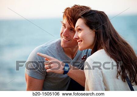 Couple in Ondarreta Wall, Donostia, San Sebastian, Gipuzkoa, Euskadi, Spain View Large Photo Image Stock Photograph - Couple in Ondarreta Wall, Donostia, San Sebastian, Gipuzkoa, Euskadi, Spain. Fotosearch
