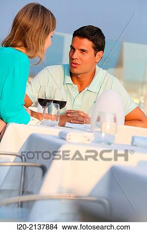 Couple in outdoor restaurant View Large Photo Image Picture - Couple in outdoor restaurant. Fotosearch