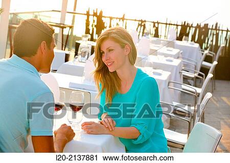 Couple in outdoor restaurant View Large Photo Image Stock Image - Couple in outdoor restaurant. Fotosearch