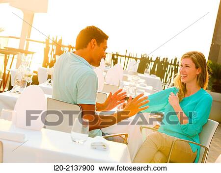 Couple in outdoor restaurant View Large Photo Image Stock Image - Couple in outdoor restaurant. Fotosearch