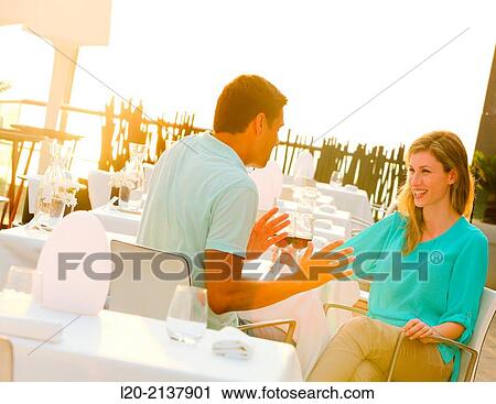Couple in outdoor restaurant View Large Photo Image Stock Image - Couple in outdoor restaurant. Fotosearch