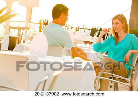 Couple in outdoor restaurant View Large Photo Image Stock Image - Couple in outdoor restaurant. Fotosearch