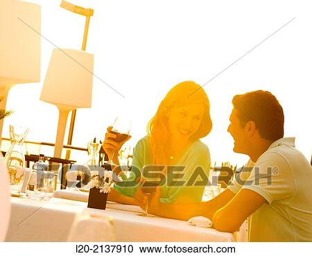 Couple in outdoor restaurant View Large Photo Image Stock Image - Couple in outdoor restaurant. Fotosearch