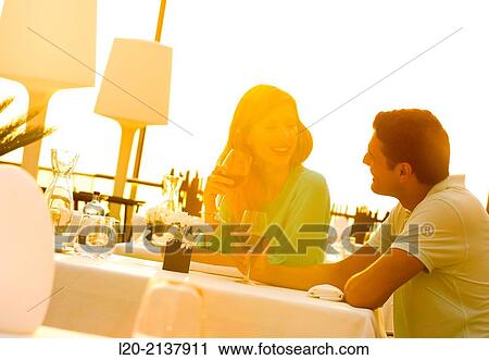 Couple in outdoor restaurant View Large Photo Image Stock Image - Couple in outdoor restaurant. Fotosearch