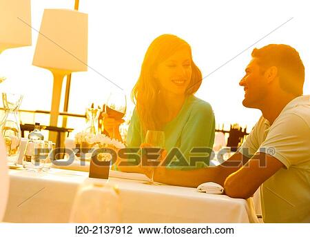 Couple in outdoor restaurant View Large Photo Image Stock Image - Couple in outdoor restaurant. Fotosearch