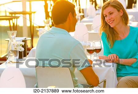 Couple in outdoor restaurant View Large Photo Image Stock Photo - Couple in outdoor restaurant. Fotosearch