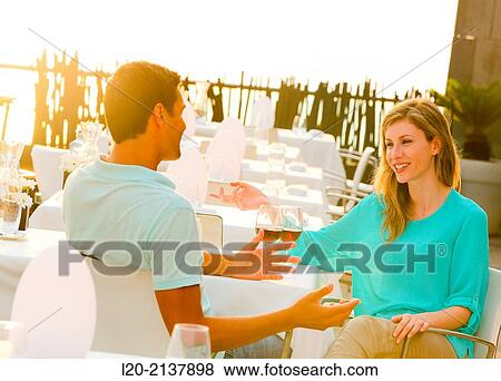 Couple in outdoor restaurant View Large Photo Image Stock Photo - Couple in outdoor restaurant. Fotosearch
