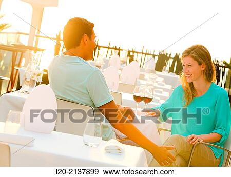 Couple in outdoor restaurant View Large Photo Image Stock Photo - Couple in outdoor restaurant. Fotosearch