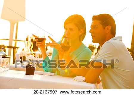 Couple in outdoor restaurant View Large Photo Image Stock Photo - Couple in outdoor restaurant. Fotosearch