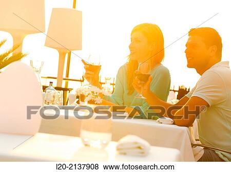 Couple in outdoor restaurant View Large Photo Image Stock Photo - Couple in outdoor restaurant. Fotosearch