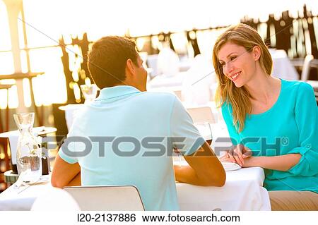 Couple in outdoor restaurant View Large Photo Image Stock Photograph - Couple in outdoor restaurant. Fotosearch