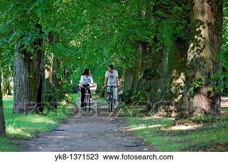 Couple in Park with Bicycles, Estonia View Large Photo Image Stock Image - Couple in Park with Bicycles, Estonia. Fotosearch
