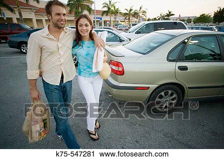 couple in parking lot with their groceries View Large Photo Image Stock Image - couple in parking lot with their groceries. Fotosearch