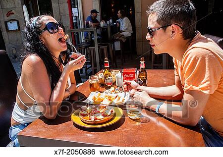 Couple in Pulperia Melide eating? Pulpo a feira? octopus in Galician style, Plaza de Espaa 16 or Plaza Campo de la Lea, Corua city, Galicia, Spain View Large Photo Image Stock Photograph - Couple in Pulperia Melide eating? Pulpo a feira? octopus in Galician style, Plaza de Espaa 16 or Plaza Campo de la Lea, Corua city, Galicia, Spain. Fotosearch