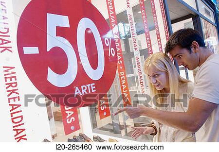 Couple in shopping center, looking at shop windows View Large Photo Image Stock Image - Couple in shopping center, looking at shop windows. Fotosearch
