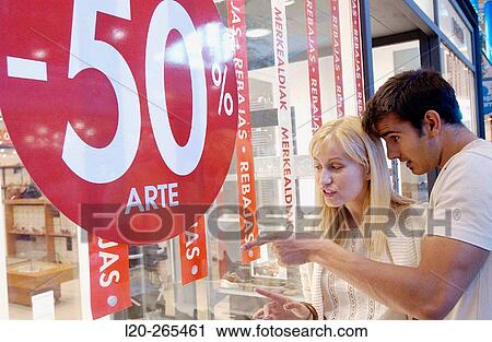 Couple in shopping center, looking at shop windows View Large Photo Image Stock Image - Couple in shopping center, looking at shop windows. Fotosearch