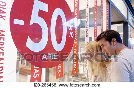 Couple in shopping center, looking at shop windows View Large Photo Image Stock Photo - Couple in shopping center, looking at shop windows. Fotosearch