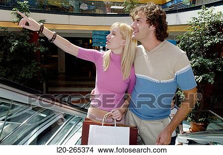 Picture - Couple in shopping center. Fotosearch