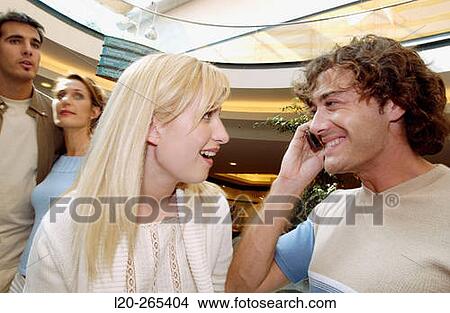 Couple in shopping center View Large Photo Image Picture - Couple in shopping center. Fotosearch