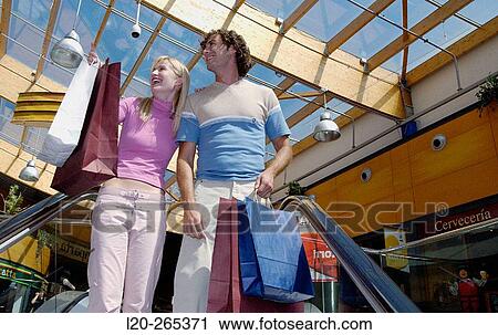Couple in shopping center View Large Photo Image Stock Image - Couple in shopping center. Fotosearch