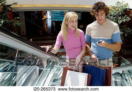 Couple in shopping center View Large Photo Image Stock Image - Couple in shopping center. Fotosearch