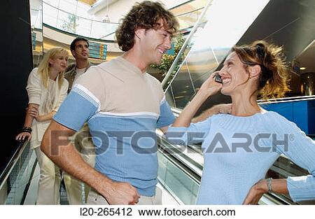 Couple in shopping center View Large Photo Image Stock Image - Couple in shopping center. Fotosearch