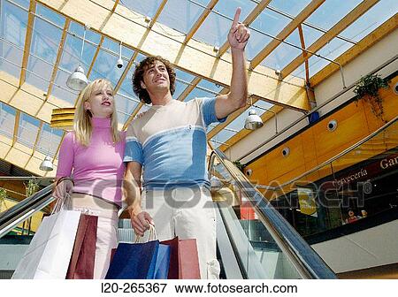 Couple in shopping center View Large Photo Image Stock Photo - Couple in shopping center. Fotosearch