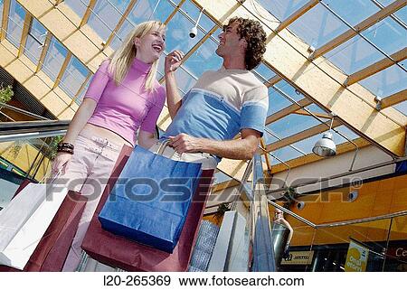 Couple in shopping center View Large Photo Image Stock Photo - Couple in shopping center. Fotosearch